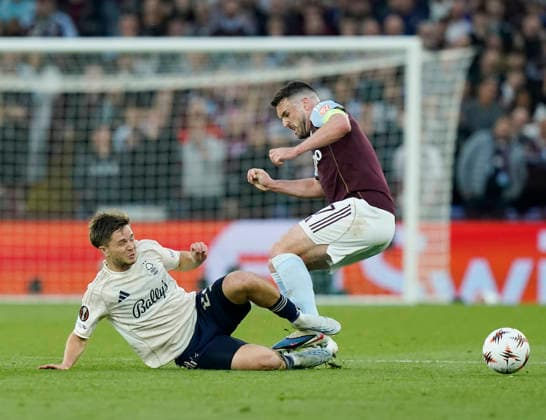 Birmingham, England, 7th May 2026. James McAtee of Nottingham Forest tackles John McGinn of Aston Villa during the Aston Villa vs Nottingham Forest UEFA Europa League semi final match 2nd leg match at Villa Park, Birmingham. Picture credit should read: Andrew Yates Sportimage EDITORIAL USE ONLY. No use with unauthorised audio, video, data, fixture lists, club league logos or live services. Online in-match use limited to 120 images, no video emulation. No use in betting, games or single club league player publications. SPI_050_AY_Villa_Forest SPI-4782-0050