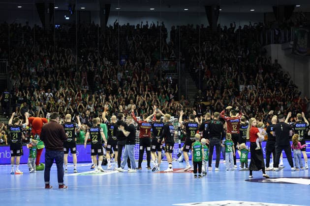 The SC Magdeburg team celebrates the victory in front of the fan block Quarterfinal Handball Machineseeker Champions League Season 2025 2026 SC Magdeburg vs SC Pick Szeged at the GETEC Arena in Magdeburg Action,Handball,Germany,07 05 2026