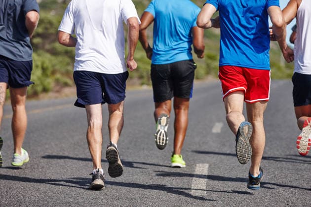 Keeping fit with friends. Cropped rearview shot of a group of men running a road race (License=RF) 20242700 ,model released, Symbolfoto  Copyright: xZoonar.com KasperxRavlox 20242700 ,model released, Symbolfoto ,property released