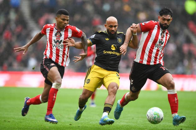 Bryan Mbeumo of Manchester United, ManU fends off Reinildo Mandava of Sunderland (left) and Omar Alderete of Sunderland (right) during the Premier League 2025 26 League match between Sunderland and Manchester United at Stadium of Light on May 9th, 2026 in Sunderland, England. Copyright: xRichardxLee SportsxPressxPhotox Sportspressphoto_SPR143080