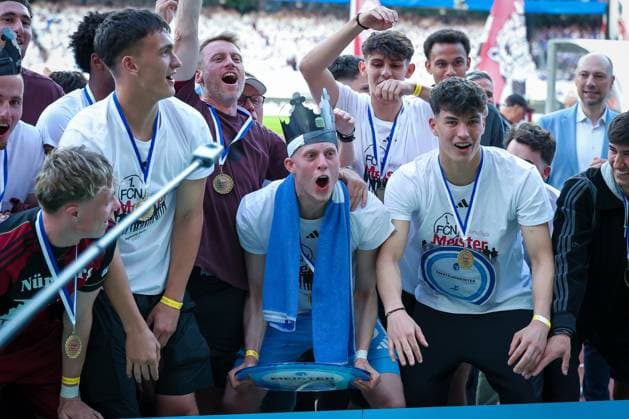 The U23 of 1 FC Nuernberg is honored for the championship in the Regionalliga Bayern, emotions, joy, 1 FC Nuernberg vs FC Schalke 04, football, men, 2 Bundesliga, DFL, season 2025 2026, 33 matchday, second round, 09 05 2026 DFB regulations prohibit any use of photographs as image sequences and or quasi video Nuernberg Bayern Germany Copyright: xkolbert-press MartinxAgüerax