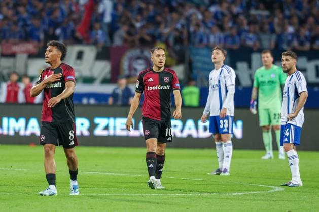 Henri Koudossou 8 1FC Nuernberg , left, celebrates his goal for 2 0, with Julian Justvan 10 1FC Nuernberg , 1 FC Nuernberg vs FC Schalke 04, Football, Men, 2 Bundesliga, DFL, Season 2025 2026, 33 Matchday, Second round, 09 05 2026 DFB regulations prohibit any use of photographs as image sequences and or quasi video Nuernberg Bayern Germany Copyright: xkolbert-press MartinxAgüerax