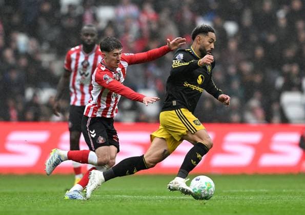 Trai Hume of Sunderland and Matheus Cunha of Manchester United, ManU Sunderland v Manchester United, Premier League, Football, Stadium of Light, Sunderland , UK - 09 May 2026Sunderland Stadium of Light United Kingdom EDITORIAL USE ONLY No use with unauthorised audio, video, data, fixture lists, club league logos or live services. Online in-match use limited to 120 images, no video emulation. No use in betting, games or single club league player publications.  Copyright: xAnnaxGowthorpe Shutterstockx 16861687aw