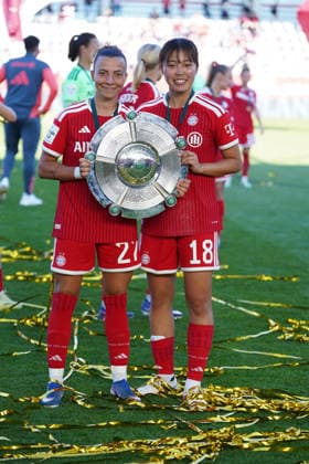 Arianna Caruso 27 Bayern and Momoko Tanikawa 18 Bayern celebrate winning the German championship of the Google Pixel Womens Bundesliga 2025 2026 on 09 05 2026 Munich FC Bayern Campus Bayern Germany with the championship trophy