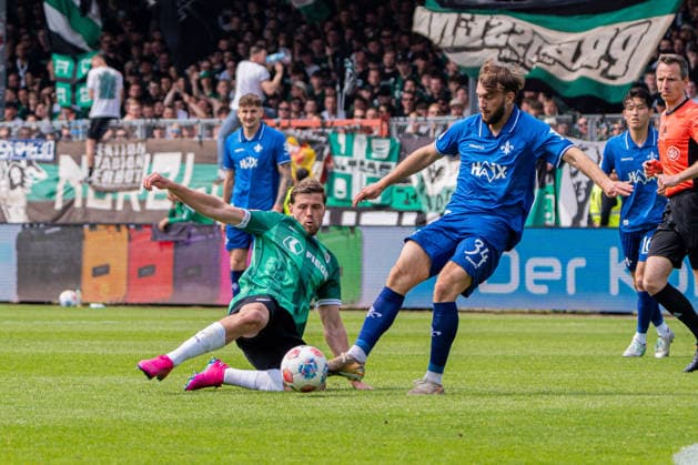 Münster, Germany 10 May 2026 2 BL 2025 2026 Sp 33 SC Preußen Münster vs SV Darmstadt 98 In the picture from left in duel Imad Rondic PRM and Killian Corredor Darmstadt DFL DFB regulations prohibit any use of photographs as image sequences and or quasi video LVM Preussenstadion Nordrhein Westfalen Copyright: xFotostandx xKruczynskix