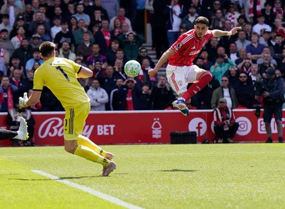 Nottingham, England, 10th May 2026. Jair Cunha of Nottingham Forest (R) has his shot saved during the Nottingham Forest vs Newcastle United Premier League match at the City Ground, Nottingham. Picture credit should read: Andrew Yates Sportimage EDITORIAL USE ONLY. No use with unauthorised audio, video, data, fixture lists, club league logos or live services. Online in-match use limited to 120 images, no video emulation. No use in betting, games or single club league player publications. SPI_013_AY_NOTTS_FOREST_NEWC SPI-4792-0013