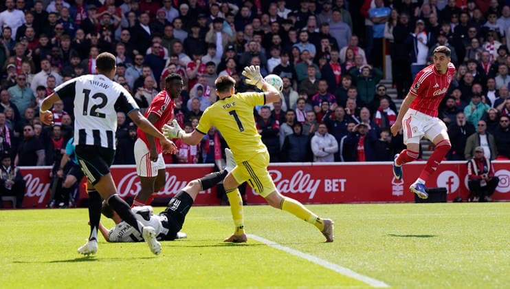 Nottingham, England, 10th May 2026. Jair Cunha of Nottingham Forest (R) has his shot saved during the Nottingham Forest vs Newcastle United Premier League match at the City Ground, Nottingham. Picture credit should read: Andrew Yates Sportimage EDITORIAL USE ONLY. No use with unauthorised audio, video, data, fixture lists, club league logos or live services. Online in-match use limited to 120 images, no video emulation. No use in betting, games or single club league player publications. SPI_014_AY_NOTTS_FOREST_NEWC SPI-4792-0014