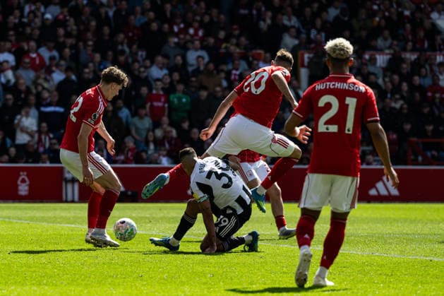 10th May 2026; The City Ground, Nottingham, England; Premier League Football, Nottingham Forest versus Newcastle United; Lorenzo Lucca of Nottingham Forest leaps over Bruno Guimaraes of Newcastle United after making a tackle GodfreyxPitt