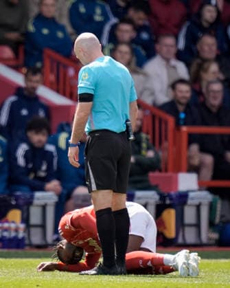 Nottingham Forest v Newcastle United - Premier League Dilane Bakwa of Nottingham Forest receives treatment during the Premier League match between Nottingham Forest and Newcastle United at City Ground in Nottingham, United Kingdom, on May 10, 2026. Nottingham Nottinghamshire United Kingdom  Copyright: xNewsxImagesx originalFilename:cosgrove-premierl260510_npwFR.jpg