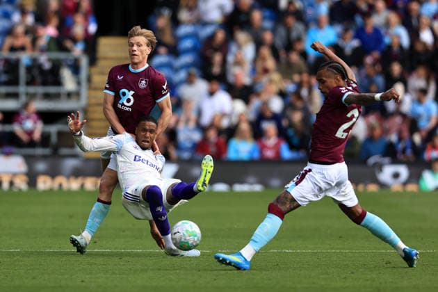 10th May 2026; Turf Moor, Burnley, Lancashire, England; Premier League Football, Burnley versus Aston Villa; Ezri Konsa of Aston Villa is brought down by Zian Flemming of Burnley DavidxBlunsden