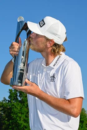 CHARLOTTE, NC - MAY 10: Kristoffer Reitan (NOR) kisses the trophy for winning the Truist Championship on May 10, 2026, at the Quail Hollow Club in Charlotte, North Carolina. (Photo by Ken Murray Icon Sportswire) GOLF: MAY 10 PGA, Golf Herren Truist Championship EDITORIAL USE ONLY Icon2605100024