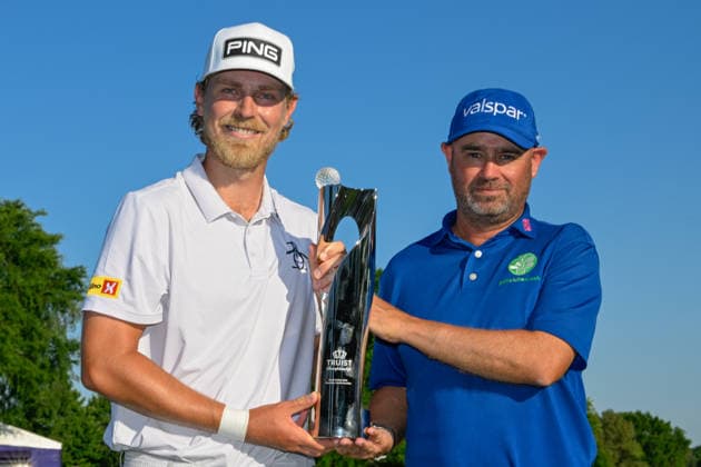 CHARLOTTE, NC - MAY 10: Kristoffer Reitan (NOR) and caddie Tim Poyser hold the trophy for winning the Truist Championship on May 10, 2026, at the Quail Hollow Club in Charlotte, North Carolina. (Photo by Ken Murray Icon Sportswire) GOLF: MAY 10 PGA, Golf Herren Truist Championship EDITORIAL USE ONLY Icon2605100054