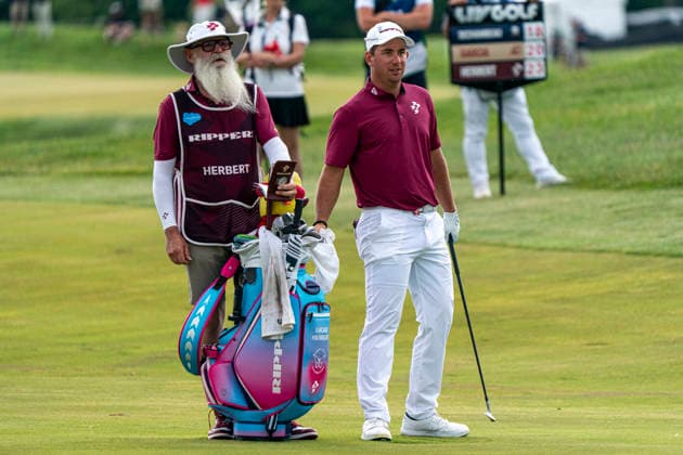 STERLING, VIRGINIA - MAY 10: Lucas Herbert of Ripper GC and his caddy analyze the fairway of the fifteenth hole during day 4 of LIV Golf Virginia at Trump National Golf Club on May 10, 2026 in Sterling, Virginia. (Photo by Ben Hsu Icon Sportswire) GOLF: MAY 10 LIV Golf Virginia EDITORIAL USE ONLY Icon224260510036