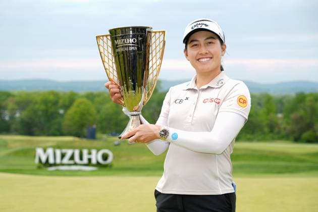 Golf: Mizuho Americas Open Jeeno Thitikul of Thailand poses with the victor s trophy after winning the Mizuho Americas Open golf tournament at Mountain Ridge Country Club in West Caldwell, New Jersey, on May 10, 2026.  A14AA0005540688P
