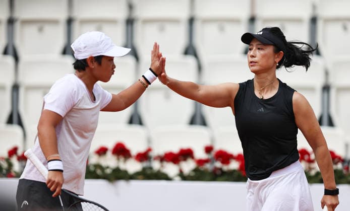 (260511) -- ROME, May 11, 2026 -- Jiang Xinyu Xu Yifan (R) celebrate during the women s doubles round of 32 match between Jiang Xinyu Xu Yifan of China and Anna Danilina of Kazakhstan Asia Muhammad of the United States at the WTA, Tennis Damen Italian Open tennis tournament in Rome, Italy, May 11, 2026. ) (SP)ITALY-ROME-TENNIS-WTA-ITALIAN OPEN-WOMEN S DOUBLES WangxKaiyan 