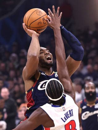 Cleveland Cavaliers Donovan Mitchell (45) shoots over Detroit Pistons Caris LeVert (8) in the fourth quarter in Cleveland, Ohio Monday May 11, 2026. The Cavaliers defeated the Pistons 112-103 to tie the series at 2 games each.  CLE20260511113 AARONxJOSEFCZYK