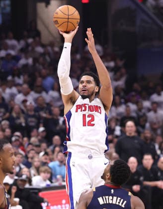 Detroit Pistons Tobias Harris (12) shoots over Cleveland Cavaliers Donovan Mitchell (45) in the fourth quarter in Cleveland, Ohio Monday May 11, 2026. The Cavaliers defeated the Pistons 112-103 to tie the series at 2 games each.  CLE20260511118 AARONxJOSEFCZYK