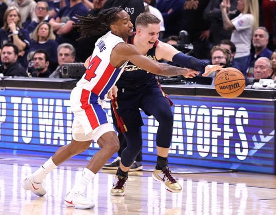 Detroit Pistons Daniss Jenkins (24) battles Cleveland Cavaliers Sam Merrill (5) for a loose ball in the fourth quarter in Cleveland, Ohio Monday May 11, 2026. The Cavaliers defeated the Pistons 112-103 to tie the series at 2 games each.  CLE20260511119 AARONxJOSEFCZYK