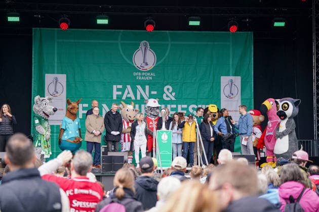 Germany Football DFB Cup Women 2025 2026, Final VfL Wolfsburg vs FC Bayern Munich Rhein Energie Stadion Köln Germany, Europe, Cologne, RheinEnergieSTADION, DFB Cup Women 2025 2026, Final, Fanfest, Stage, DFB Cup Trophy, Cup Presentation, Family Event, Football Festival, womens football, VfL Wolfsburg, FC Bayern Munich women, mascot, spectators, fans, entertainment, event stage, moderation, DFB, sporting event, public event, fan culture, Cologne tourism, ADAC, media event, stadium environment, football atmosphere, crowd, Bundesliga women, sporting event Copyright: xJOERANxSTEINSIEKx