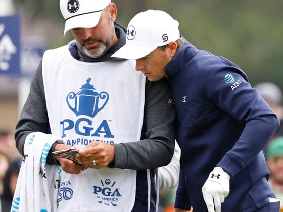 Jordan Spieth consults with his caddie before teeing off on the 11th hole during the first round of the 2026 PGA, Golf Herren Championship at Aronimink Golf Club in Newtown Square, Pennsylvania, on Thursday, May 14, 2026.  PHI20260514827 LAURENCExKESTERSON