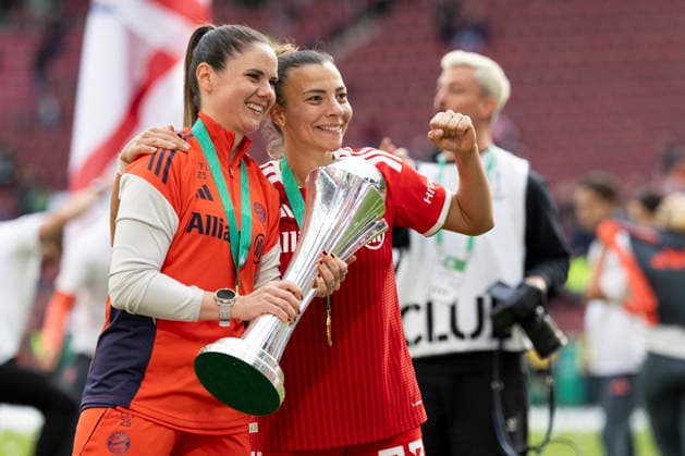 Arianna CARUSO M 27, left and Arianna CARUSO M 27, right with the cup in her hand Joy, laughter, jubilation DFB Pokal der Frauen Finale 2026, VfL Wolfsburg WOB FC Bayern Muenchen M , final score 0 4, am 14 05 2026 in Koeln Germany DFB regulations prohibit any use of photographs as image sequences and or quasi video Â