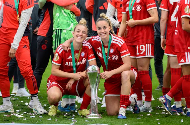 Cheering Carolin SIMON l M and Giulia GWINN M with the trophy DFB Cup Womens Final 2026, VfL Wolfsburg WOB FC Bayern Muenchen M 0 4, on 14 05 2026 in Cologne Germany DFB regulations prohibit any use of photographs as image sequences and or quasi video Â