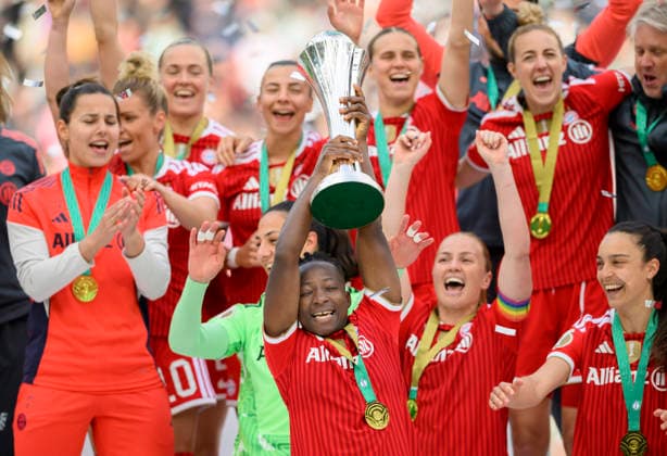 Award ceremony, cheering Bernadette AMANI M with the trophy DFB Cup Womens Final 2026, VfL Wolfsburg WOB FC Bayern Muenchen M 0 4, on 14 05 2026 in Cologne Germany DFB regulations prohibit any use of photographs as image sequences and or quasi video Â