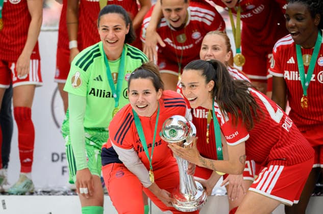 Award ceremony, cheering l r Goalkeeper Goalkeeper Maria Luisa GROHS M , Lena OBERDORF M , Natalia PADILLA BIDAS M , with the trophy DFB Cup Womens Final 2026, VfL Wolfsburg WOB FC Bayern Muenchen M 0 4, on 14 05 2026 in Cologne Germany DFB regulations prohibit any use of photographs as image sequences and or quasi video Â