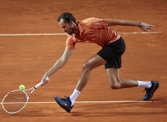 (260515) -- ROME, May 15, 2026 -- Daniil Medvedev of Russia hits a return during the men s singles quarterfinal match between Martin Landaluce of Spain and Daniil Medvedev of Russia at the ATP, Tennis Herren Italian Open in Rome, Italy, May 14, 2026. ) (SP)ITALY-ROME-TENNIS-ATP-MARTIN LANDALUCE VS DANIIL MEDVEDEV LixJing 