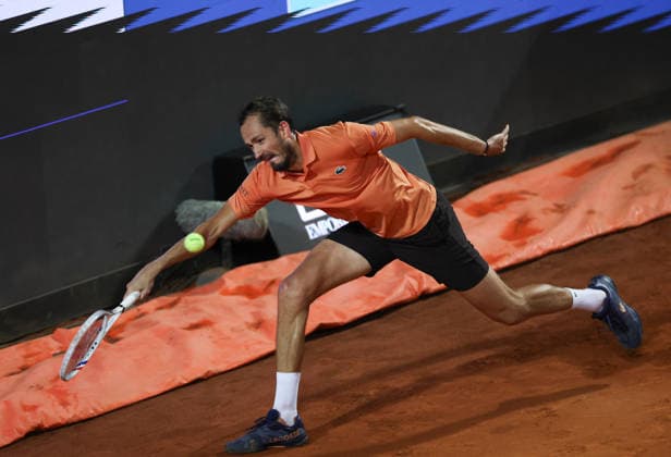 (260515) -- ROME, May 15, 2026 -- Daniil Medvedev of Russia hits a return during the men s singles quarterfinal match between Martin Landaluce of Spain and Daniil Medvedev of Russia at the ATP, Tennis Herren Italian Open in Rome, Italy, May 14, 2026. ) (SP)ITALY-ROME-TENNIS-ATP-MARTIN LANDALUCE VS DANIIL MEDVEDEV LixJing 