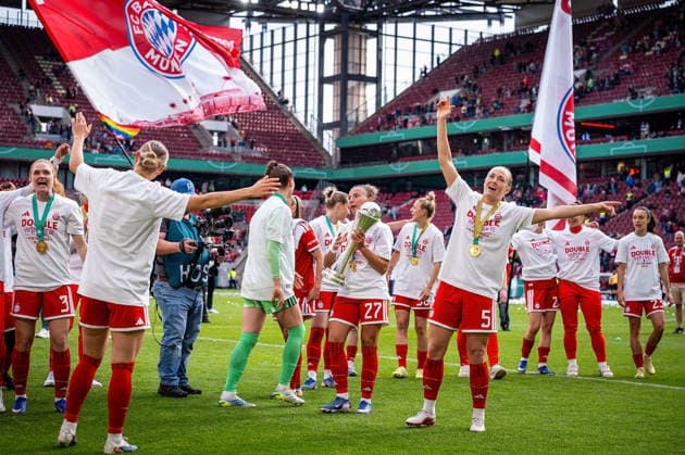 14 05 2026, xovx, Football, Women DFB Cup Final, VfL Wolfsburg FC Bayern Munich The players of FC Bayern Munich celebrate the double by winning the German Championship and the DFB Cup after the 4 0 victory over VfL Wolfsburg In front Arianna Caruso FC Bayern Munich with the cup Cologne Rhein Energie Stadium North Rhine-Westphalia Germany EN