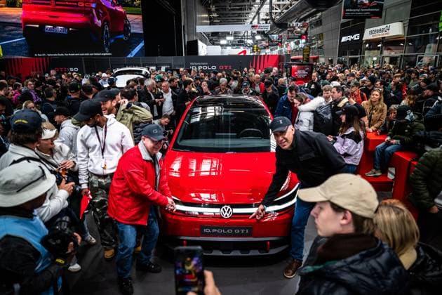 Crowd gathers around the red Volkswagen ID Polo GTI at the world premiere at the Nürburgring World premiere Volkswagen ID Polo GTI Copyright: xMichaelxGelhardtx