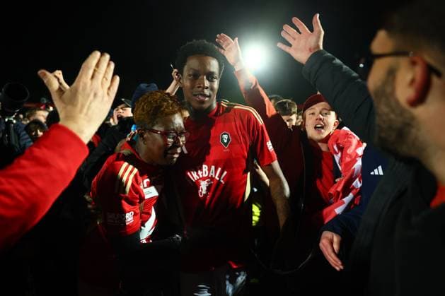 Kallum Cesay of Salford City celebrates at the end of the match with his mum Salford City v Grimsby Town, EFL Sky Bet League Two, Play-Off Semi Final, Second Leg, Football, Peninsula Stadium, Salford, UK - 15 May 2026Salford Peninsula Stadium United Kingdom EDITORIAL USE ONLY No use with unauthorised audio, video, data, fixture lists, club league logos or live services. Online in-match use limited to 120 images, no video emulation. No use in betting, games or single club league player publications. Copyright: xPaulxCurrie Shutterstockx 16876823db