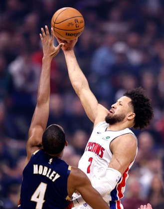 Detroit Pistons Cade Cunningham (2) scores over Cleveland Cavaliers Evan Mobley (4) in the first quarter in Cleveland, Ohio Friday May 15, 2026.  CLE20260515101 AARONxJOSEFCZYK