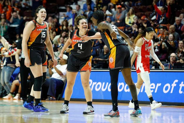 UNCASVILLE, CT - MAY 15: Raegan Beers 15 of the Connecticut Sun, Charlisse Leger-Walker 4 of the Connecticut Sun and Saniya Rivers 22 of the Connecticut Sun celebrate during the WNBA, Basketball Damen, USA game between Las Vegas Aces and Connecticut Sun on May 15, 2026, at Mohegan Sun Arena in Uncasville, CT. (Photo by M. Anthony Nesmith Icon Sportswire) WNBA: MAY 15 Las Vegas Aces at Connecticut Sun EDITORIAL USE ONLY Icon26051533