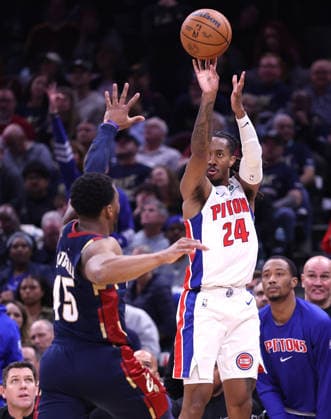 Detroit Pistons Daniss Jenkins (24) shoots a three over Cleveland Cavaliers Donovan Mitchell (45) in the fourth quarter in Cleveland, Ohio Friday May 15, 2026. The Pistons Defeated the Cavaliers 115-94.  CLE20260515115 AARONxJOSEFCZYK