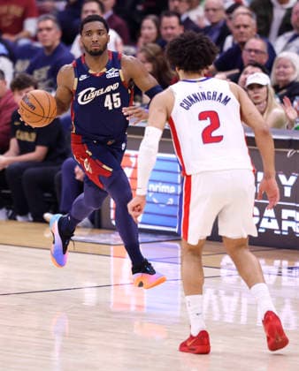 Cleveland Cavaliers Donovan Mitchell (45) brings the ball across midcourt defended by Detroit Pistons Cade Cunningham (2) during the second quarter in Cleveland, Ohio Friday May 15, 2026.  CLE20260515117 AARONxJOSEFCZYK