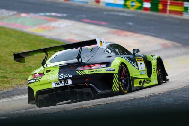 The Mercedes AMG GT3 with starting number 11 from SR Motorsport by Schnitzelalm drives through a bend on the Nordschleife of the Nürburgring The striking black, yellow and green car Jannes Fittje Jay Mo Härtling Kenneth Heyer Philip Ellis SR Motorsport by Schnitzelalm bears the sponsors Schnitzel Alm, Goodyear, RAVENOL and H R and offers a dynamic rear view with a large rear wing Mercedes AMG GT3 11 from SR Motorsport by Schnitzelalm on the Nordschleife Copyright: xspeedshotx