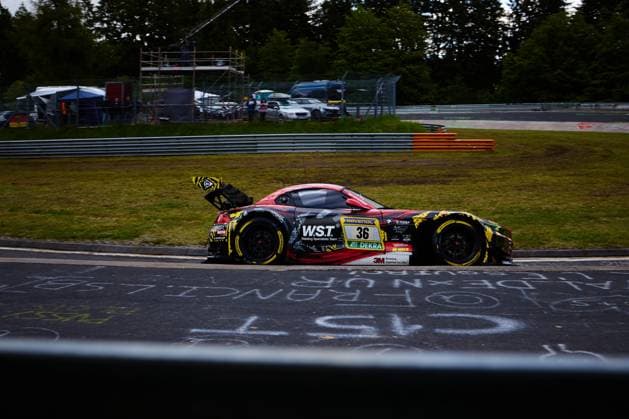 The car with starting number 36 from Saugmotoren Motorsport 3M negotiates a bend on the Nordschleife at the Nürburgring The BMW M4 GT3 in its striking red, black and yellow camouflage design bears the sponsors W S T Welding Specialists Team , RAVENOL, DEKRA and 3M Christian Scherer Henry Walkenhorst Julian Reeh Ralf Schall Saugmotoren Motorsport 3M BMW M4 GT3 36 from Saugmotoren Motorsport 3M on the Nordschleife Copyright: xspeedshotx