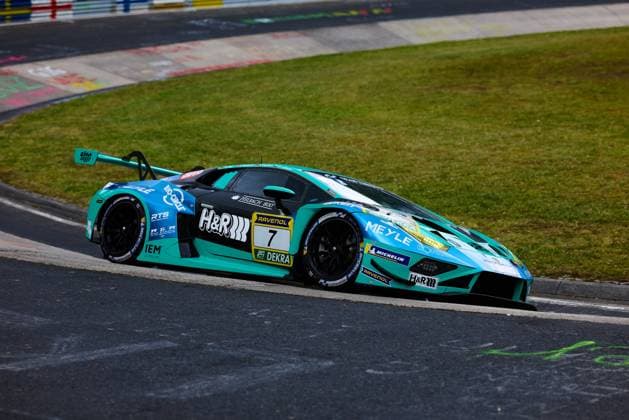 The Lamborghini Huracán GT3 with starting number 7 from Konrad Motorsport drives through a curve on the Nordschleife of the Nürburgring The turquoise and black car Christian Engelhart Maximilian Paul Patricija Stalidzane Pavel Lefterov Konrad Motorsport bears the sponsors H R, RAVENOL and MEYLE prominently on the bodywork The characteristic green areas and curbs of the famous race track can be seen in the background Lamborghini Huracán GT3 7 from Konrad Motorsport on the Nordschleife Copyright: xspeedshotx