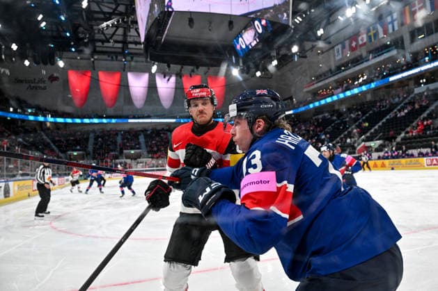 ZURICH, SWITZERLAND MAY 16 Simeon Schwinger of Austria hits Joseph Hazeldine of Great Britain along the boards during the 2026 IIHF Ice Hockey World Championship Switzerland game between Great Britain and Austria at Swiss Life Arena on May 16, 2026 in Zurich, Zurich Zurich Swiss Life Arena Zurich Switzerland Switzerland Copyright: xJustPictures.ch AndreaxBrancax jp-en-EuSpIm-JP7_ANB_GB_AU_16052026_3188