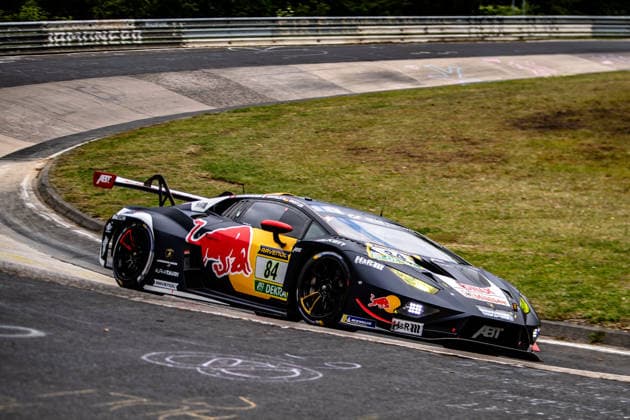 Red Bull Team ABT 84 SP 9 A black Lamborghini Huracan GT3 EVO2 with eye-catching Red Bull advertising drives along a bend on the Nordschleife of the Nürburgring Rhineland-Palatinate Germany
