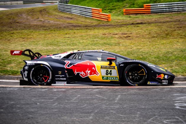 Red Bull Team ABT 84 SP 9 The black Lamborghini Huracan GT3 EVO2 with starting number 84 and Red Bull advertising drives on the Nürburgring racetrack in Rhineland-Palatinate Germany
