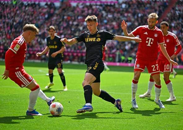 16 05 2026, Soccer Bundesliga 2025 2026, Matchday 34, FC Bayern Munich 1 FC Cologne, at the Allianz Arena Munich, f l Lennart Karl FC Bayern Munich , against Kristoffer Lund 1 FC Cologne , Konrad Laimer FC Bayern Munich and Jamal Musiala Bayern Munich DFL and DFB regulations prohibit any use of photographs as image sequences and or quasi video