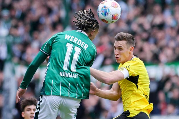 Justin Njinmah Werder Bremen and Nico Schlotterbeck Borussia Dortmund battle for the ball, Bundesliga, SV Werder Bremen v Borussia Dortmund, Weserstadion, May 16, 2026 in Bremen, Germany Photo by Marco Steinbrenner DeFodi Images Justin Njinmah Werder Bremen and Nico Schlotterbeck Borussia Dortmund battle for the ball, Bundesliga, SV Werder Bremen v Borussia Dortmund, Weserstadion, May 16, 2026 in Bremen, Germany Photo by Marco Steinbrenner DeFodi Images DFL regulations prohibit any use of photographs as image sequences and or quasi video