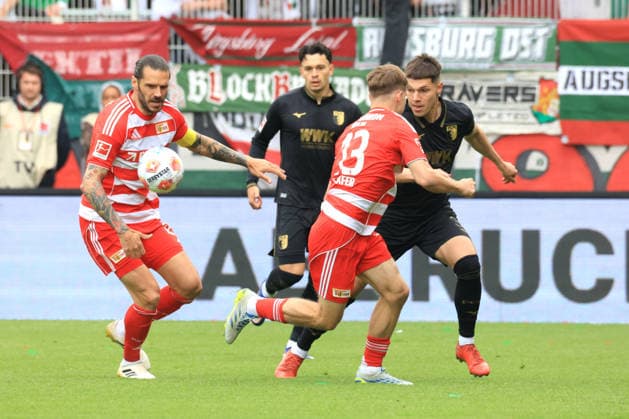 DEU, DFL, 1 FBL, 1 FC Union vs FC Augsburg, 16 05 2026, Stadion Alte Foersterei, Berlin, DEU, DFL, 1 FBL, 1 FC Union vs FC Augsburg, in the picture Christopher Trimmel 1 FC Union Berlin 28 , Andras Schaefer 1 FC Union Berlin 13 , Merkt Koemuer FC Augsburg 36 , Robin Fellhauer FC Augsburg 19 DFL regulations prohibit any use of Photographs as image sequences and or quasi video nordphotoxGmbHx xEngler nph00076