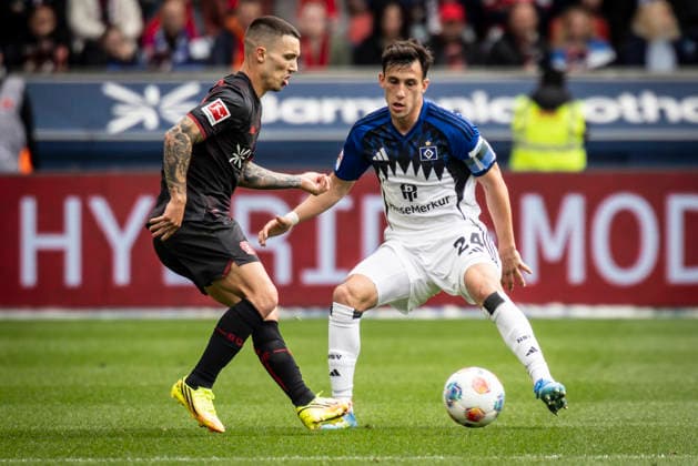 LEVERKUSEN, GERMANY - MAY 16, 2026 : Alejandro Grimaldo (Bayer 04 Leverkusen, 20), Nicolas Capaldo (Hamburger SV, 24) during the German Bundesliga match on gameday 34 between Bayer 04 Leverkusen vs. Hamburger SV at BayArena on May 16, 2026 in Leverkusen, Germany. DFL REGULATIONS PROHIBIT ANY USE OF PHOTOGRAPHS AS IMAGE SEQUENCES AND OR QUASI-VIDEO. Northrhine-Westphalia Germany Copyright: xAxelxKohringx