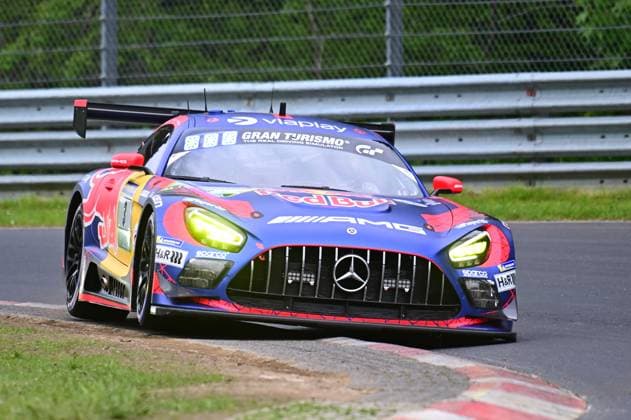 The Mercedes AMG GT3 with starting number 3 of Mercedes AMG Team Verstappen Racing drives through a corner at the Nürburgring The car Daniel Juncadella Jules Gounon Lucas Auer Max Verstappen Mercedes AMG Team Verstappen Racing presents itself in the striking Red Bull Livery in blue and red with sponsors such as Gran Turismo, Viaplay and AMG on the asphalt of the Nordschleife at the ADAC RAVENOL 24h Nürburgring 2026 Mercedes AMG GT3 3 from Verstappen Racing at the Nürburgring Copyright: xMichaelxGelhardtx