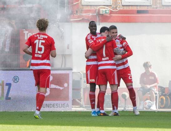 Soccer, Men, Season 2025 2026, 1 Bundesliga 34 Matchday , 1 FC Union Berlin FC Augsburg, f l Tom Rothe 1 FC Union Berlin , Ilyas Ansah 1 FC Union , Oliver Burke 1 FC Union Berlin , Andrej Ilic 1 FC Union Berlin , Celebration after goal to 2 0, 16 05 2026, Copyright: xMatthiasxKochx