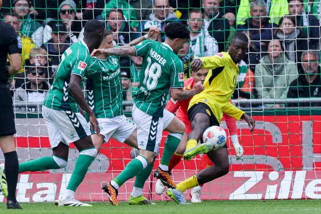Karim Coulibaly Werder Bremen , Marco Friedl Werder Bremen , Cameron Puertas Werder Bremen and Serhou Guirassy Borussia Dortmund battle for the ball, Bundesliga, SV Werder Bremen v Borussia Dortmund, Weserstadion on May 16, 2026 in Bremen, Germany Photo by Marco Steinbrenner DeFodi Images Karim Coulibaly Werder Bremen , Marco Friedl Werder Bremen , Cameron Puertas Werder Bremen and Serhou Guirassy Borussia Dortmund battle for the ball, Bundesliga, SV Werder Bremen v Borussia Dortmund, Weserstadion, May 16, 2026 in Bremen, Germany Photo by Marco Steinbrenner DeFodi Images DFL regulations prohibit any use of photographs as image sequences and or quasi video